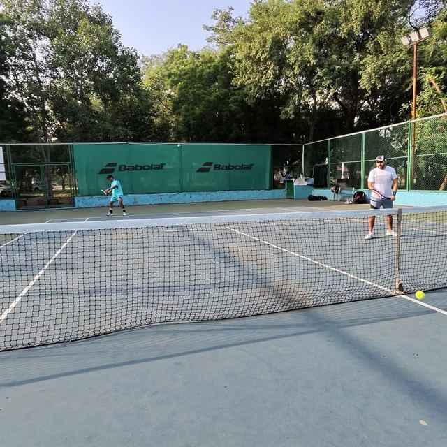 A singles point in play on a Midlife Masters court