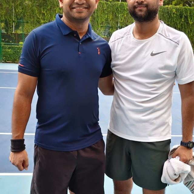 Two players before a match on the hard court